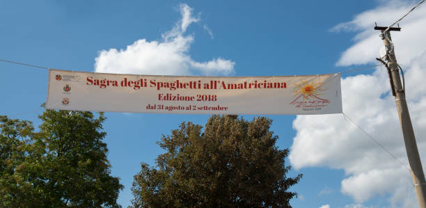 spaghetti festival all'amatriciana - Amatrice - Italy Amatrice, Italy - September 1, 2018: spaghetti festival sign all'amatriciana, typical dish of Amatrice country. amatrice stock pictures, royalty-free photos & images