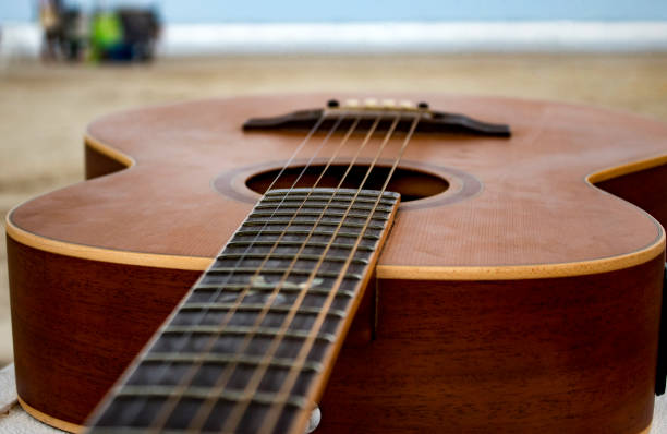 istock Acoustic Guitar at the Beach 1038888240