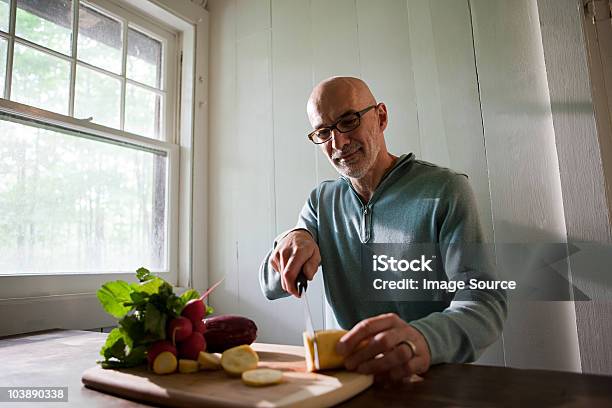 Senior Man Preparing Food Indoors Stock Photo - Download Image Now - 60-64 Years, Active Seniors, Adult