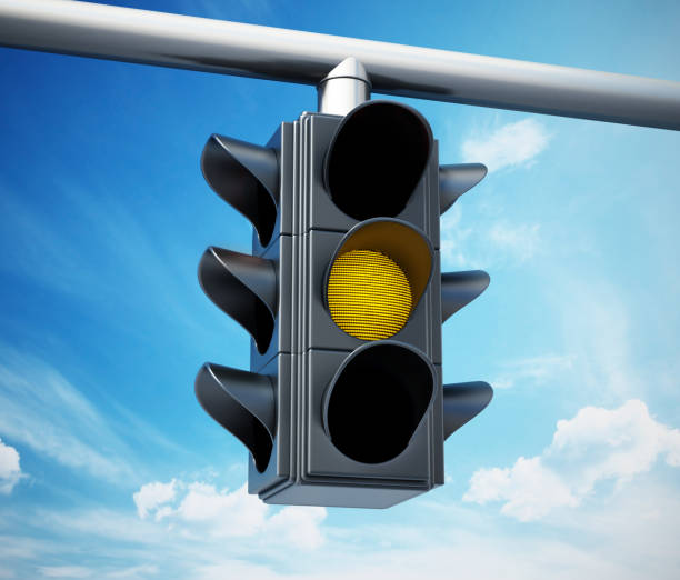 istock Yellow traffic light against blue sky 1038916720