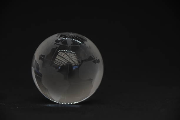 istock Transparent glass globe on black background 1038923120