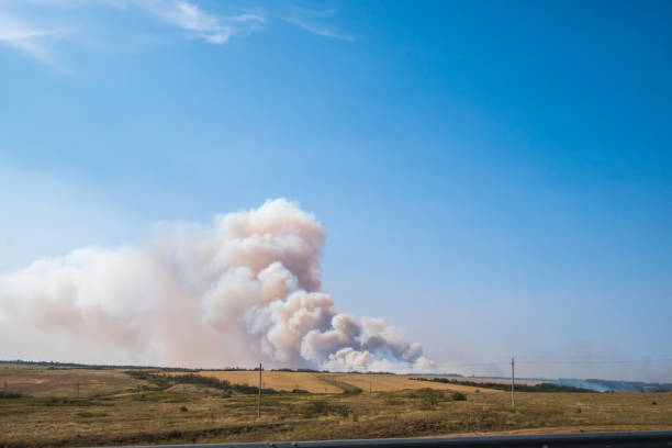 istock a big cloud of thick smoke rising from the ground 1038929314