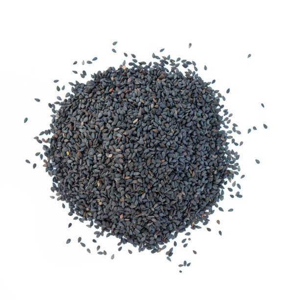 istock Heap of black sesame on white background. 1038931090