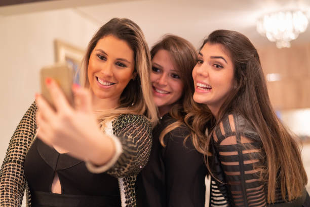 istock Girls taking a selfie house party 1038937256