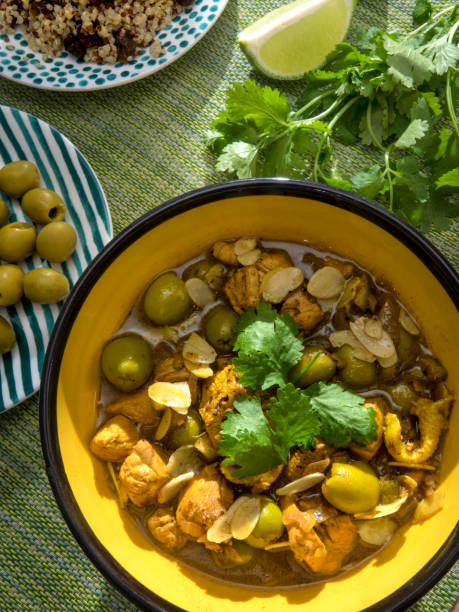 istock Chicken with lemon and olive and almonds served with quinoa and raisins 1038938646