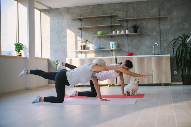 istock Enjoying doing yoga with my daughter 1038948136