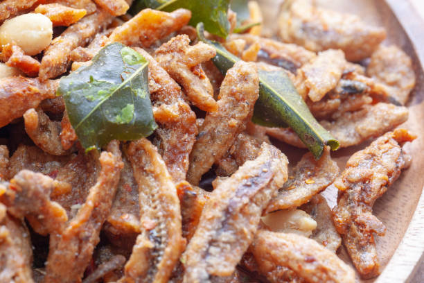 istock close up of Crispy deep fried small fish on plate 1038955864