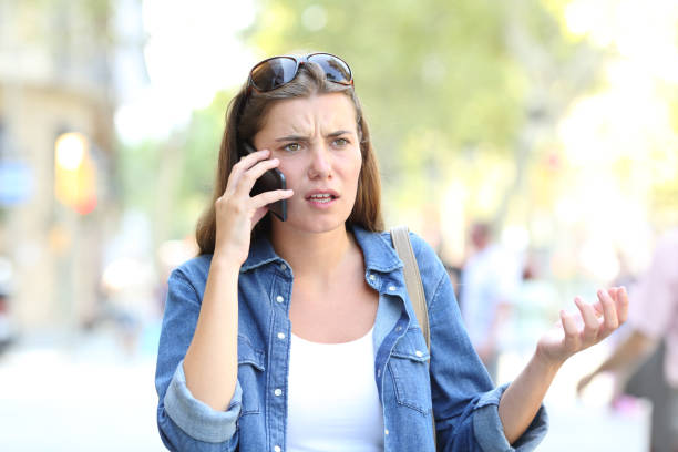 istock Confused woman having a phone conversation 1038959980