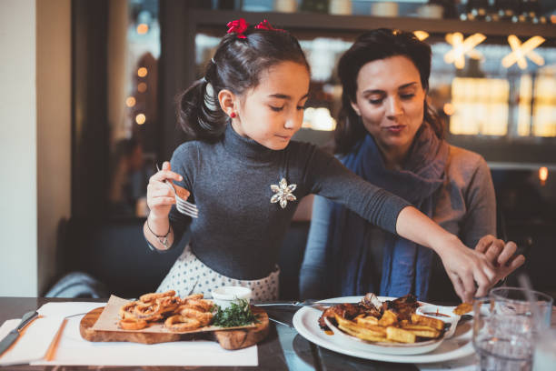 istock Hungry girls dining in restaurant 1038963864