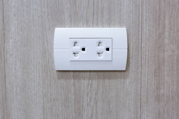 istock White rubber plug power line is electrical plugged into the power 1038972802