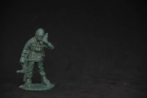 istock A toy soldier on a black background 1038973464