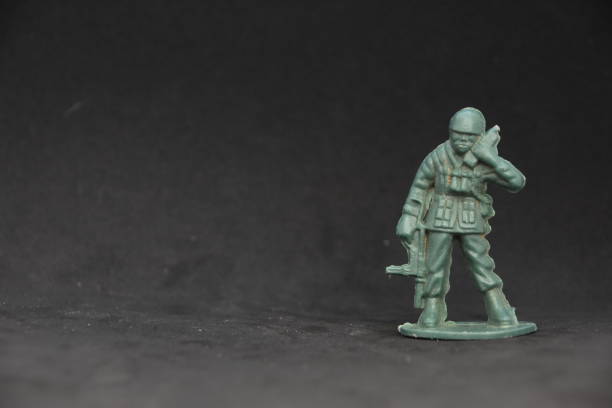 istock A toy soldier on a black background 1038973580