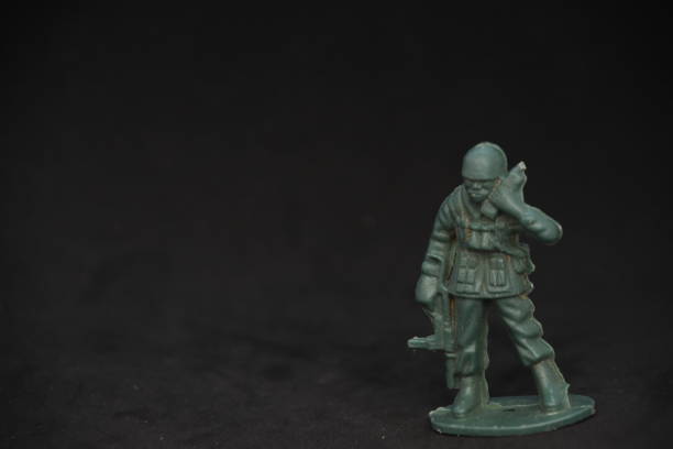 istock A toy soldier on a black background 1038974804