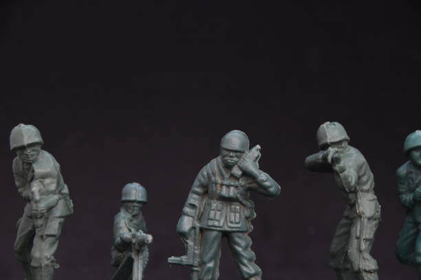 istock A toy soldier on a black background 1038977788