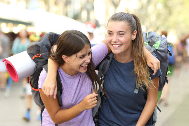 istock Happy backpackers laughing enjoying vacation 1038978882