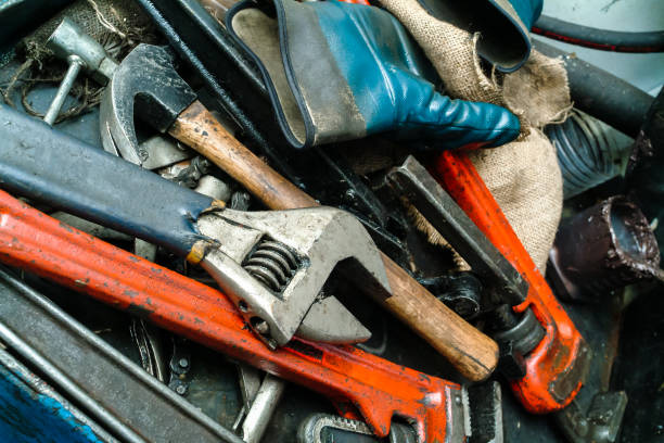 istock Closeup of an Adjustable Wrench, Hammer and Other Used Tools 1038994334