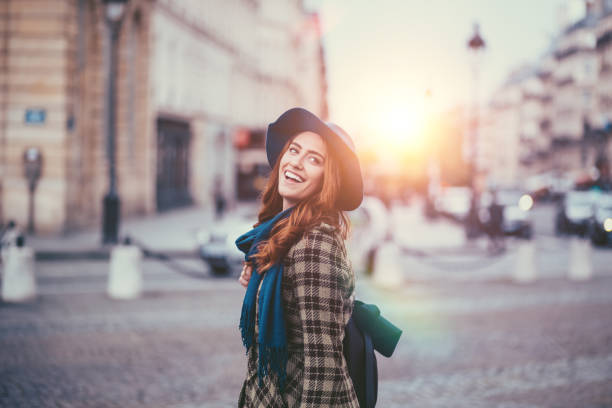 Smiling woman in Paris looking at view