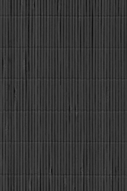 istock Black Bamboo Place Mat Rustic Interlaced Slatted Coarse Background Texture 1039008224