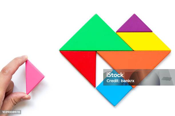 Color Wood Tangram Puzzle In Heart Shape Wait To Fulfill On White Background Stock Photo - Download Image Now