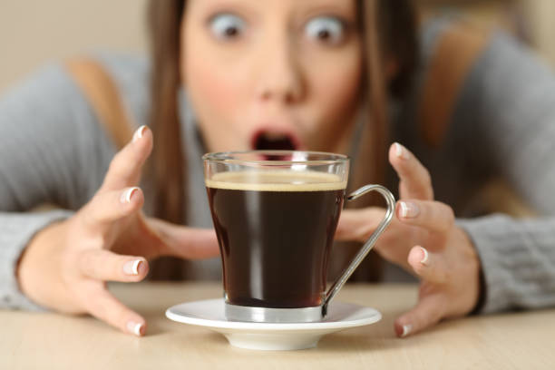 istock Amazed woman looking at coffee cup 1039023888