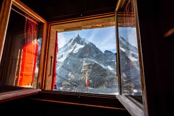 istock The Matterhorn through an open window at an alpine hut on a sunny day 1039036718