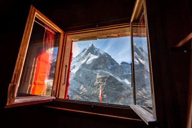 istock The Matterhorn through an open window at an alpine hut on a sunny day 1039037438