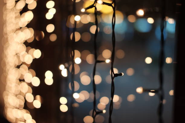 istock Blurred Christmas lights. Christmas garland on the window 1039044554