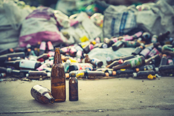 istock glass bottle for recycle on blurred glass bottle pile. 1039052402