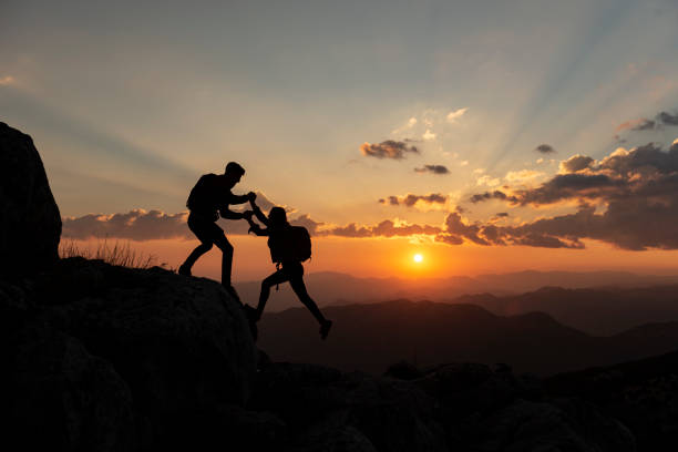 istock help the female mountaineer 1039055294