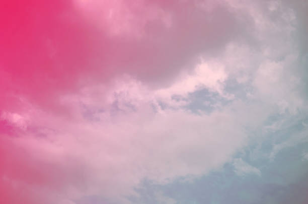 istock Nature background. Fluffy soft clouds in sky toned. 1039061200