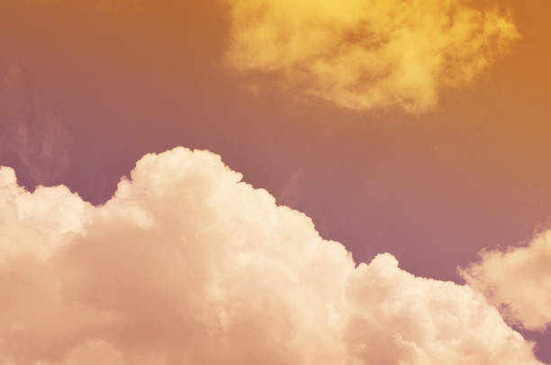 istock Nature background. Fluffy soft clouds in sky toned. 1039067098