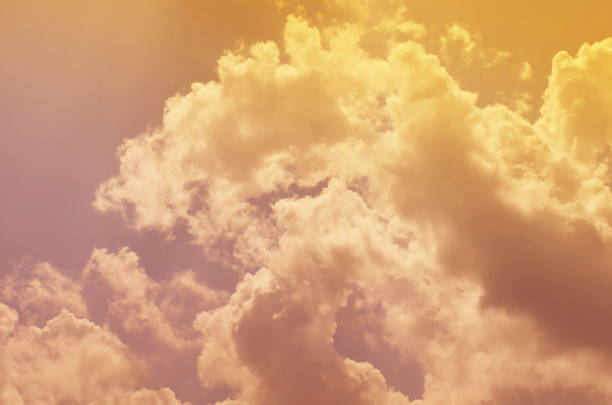 istock Nature background. Fluffy soft clouds in sky toned. 1039070326