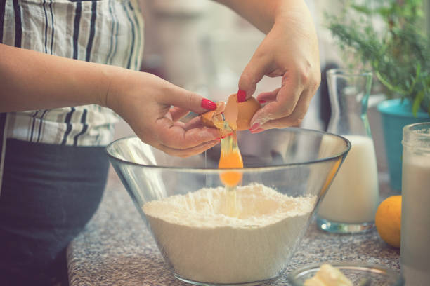 istock Woman Preparing Donuts at Home 1039102276