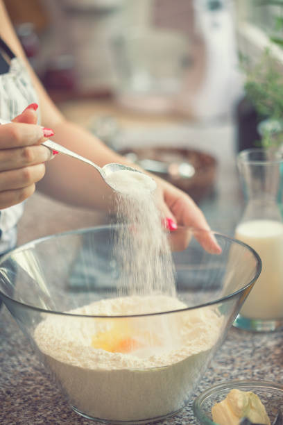 istock Woman Preparing Donuts at Home 1039103712
