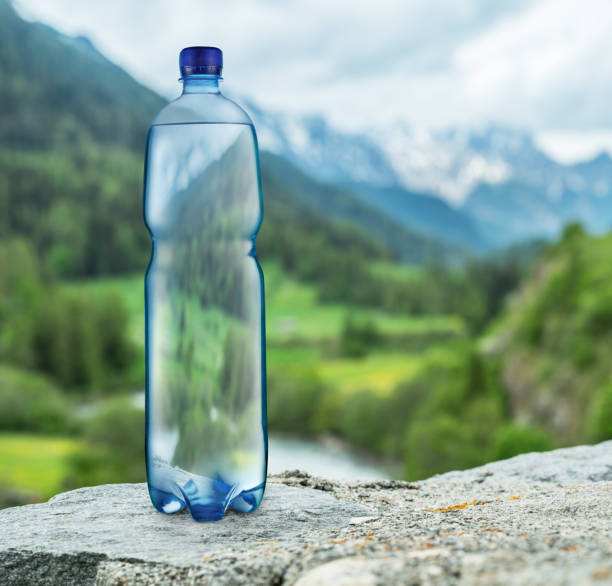 istock Bottle of water on the stone. 1039112388