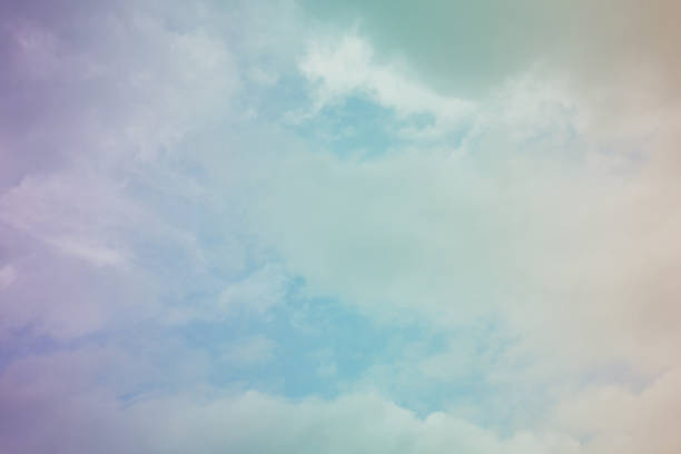 istock Nature background. Fluffy soft clouds in sky toned. 1039117382