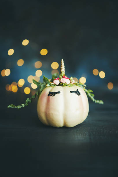 istock Handmade unicorn pumpkin with string lights 1039126102