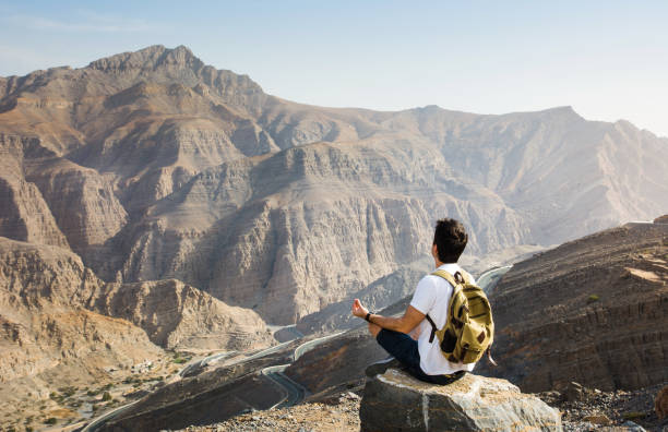 istock Man meditating on the mountain top 1039133024
