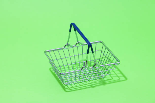istock Stainless steel basket on green background 1039141920