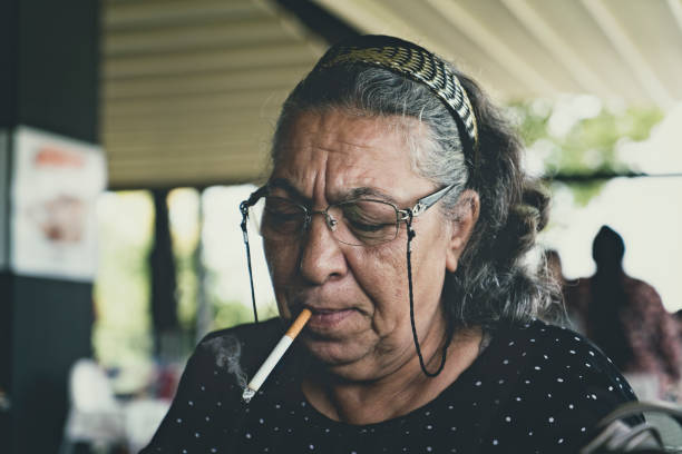 istock Elderly woman smoking cigarette 1039151026