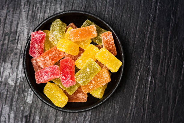 istock Jelly candy pieces in dark bowl 1039152568