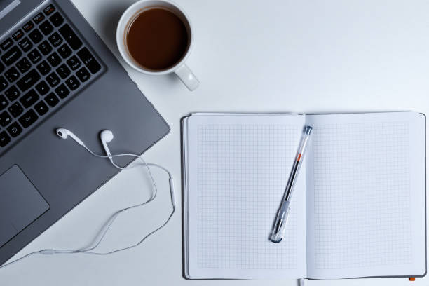 istock workstation with laptop top view on white background. Top view 1039164148