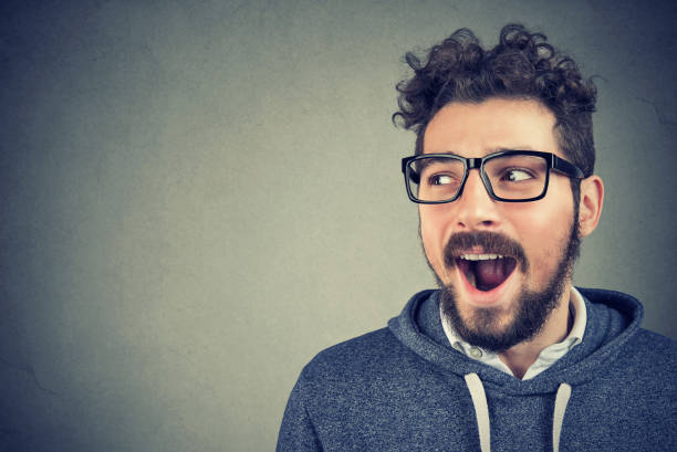 istock Curious excited man listening to gossips 1039164692