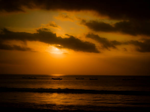 istock sunset at Kuta beach in Bali, Indonesia 1039172608