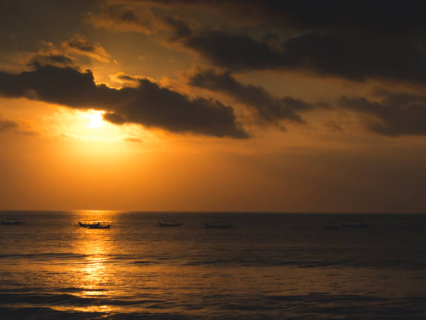 istock sunset at Kuta beach in Bali, Indonesia 1039176998