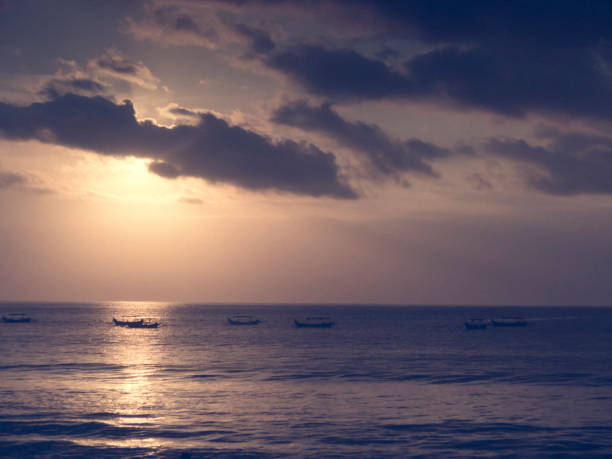 istock sunset at Kuta beach in Bali, Indonesia 1039177238