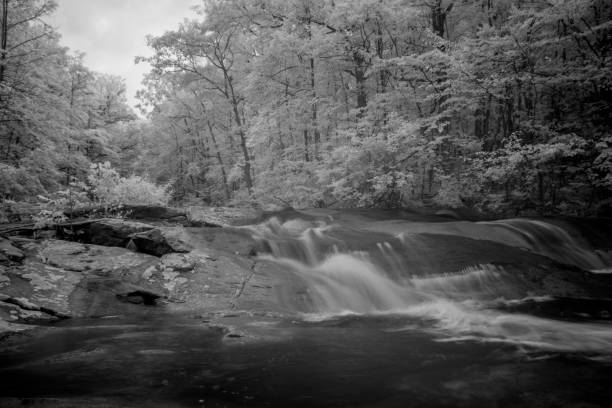 istock Waterfall Flowing Over Contoured Bedrock On Pennsylvania Stream In Infrared 1039183776
