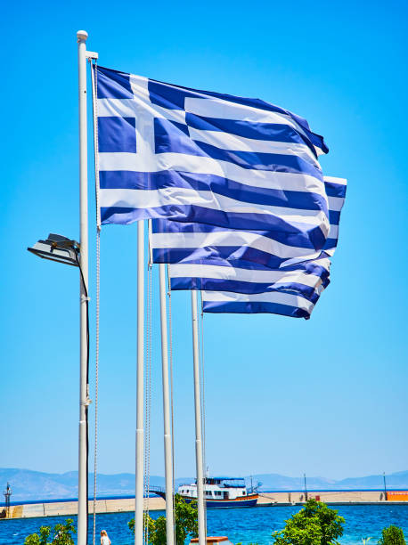 istock Flags of Greece waving on a blue sky. 1039189304