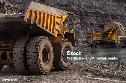 istock quarry dump trucks in coal mining 1039194006
