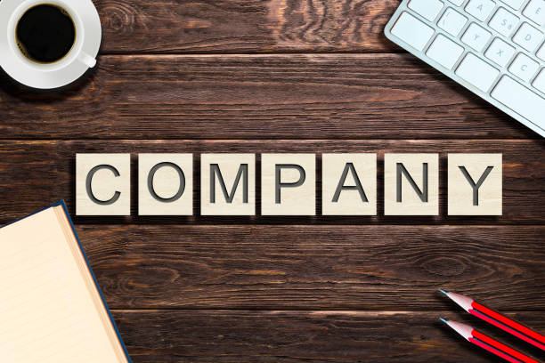 istock High angle view on business words made from wooden blocks on office table 1039197838